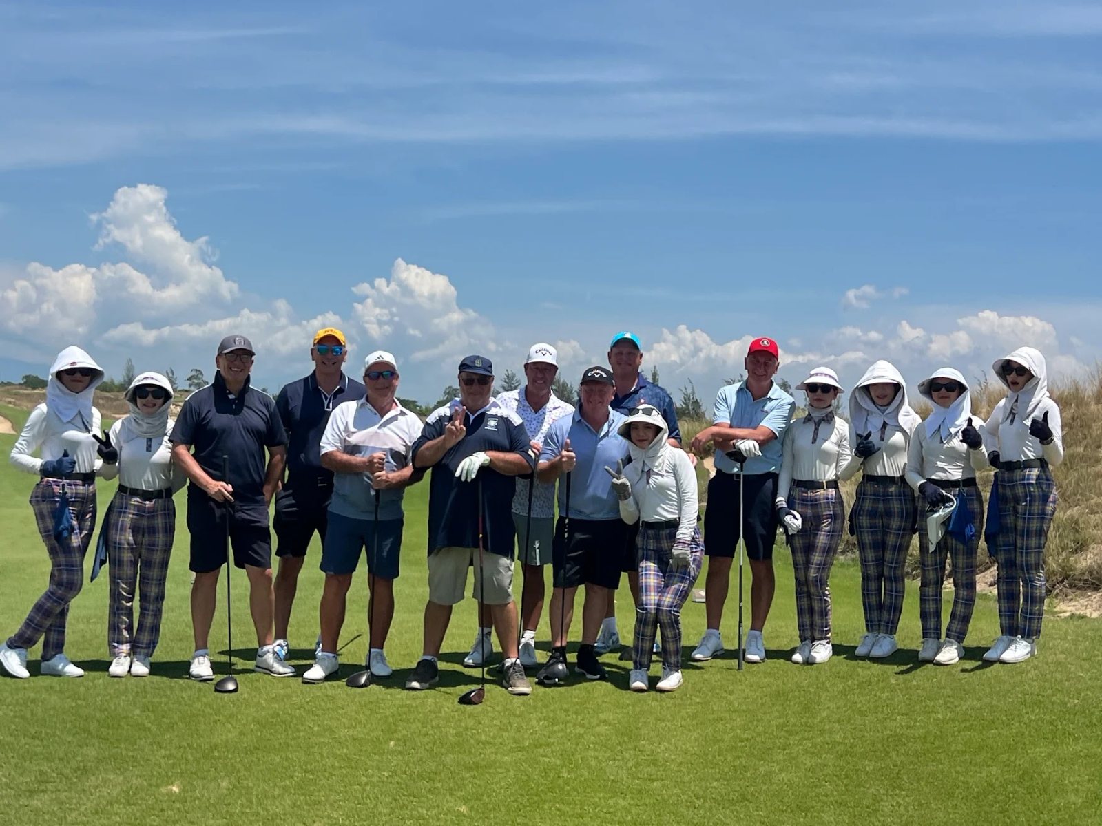Social Fairways group with their caddies on the course